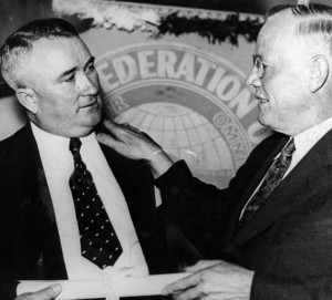 William Green, president of the American Federation of Labor (AFL) presents Francis Dillon with the international charter that establishes the United Automobile Workers of America, Detroit, Michigan. 